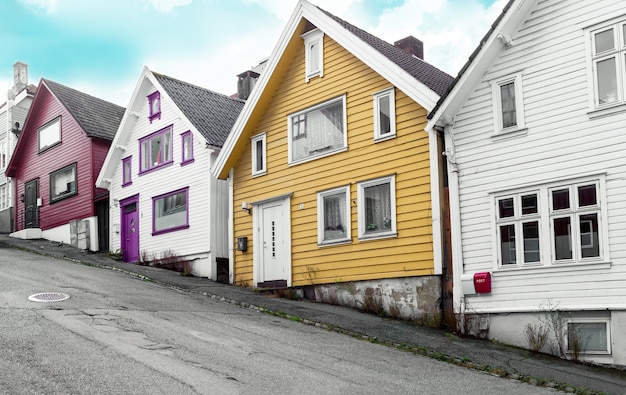 Street on a Stavanger with colorful houses and sidewalk