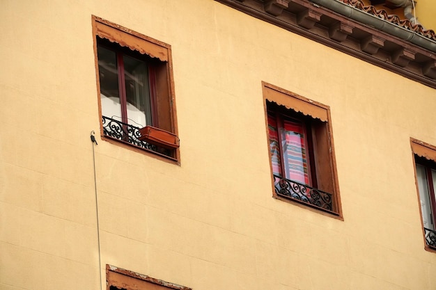 Street view looking up at apartment block in city Madrid. Traditional architecture of Madrid, Spain