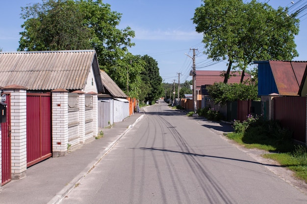 Street in the village in summer with a blue sky