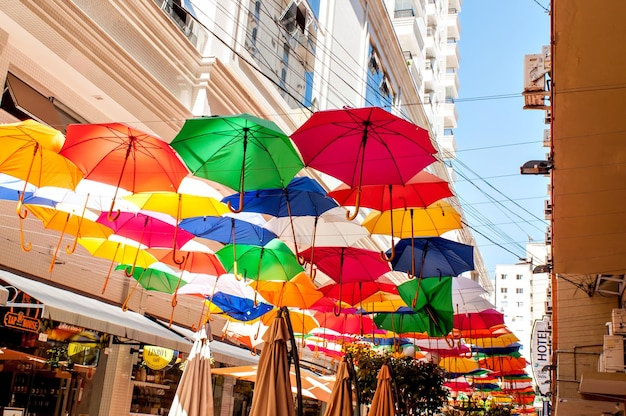 Street with many colorful umbrellas and bars in Balneario CamboriuBrazil