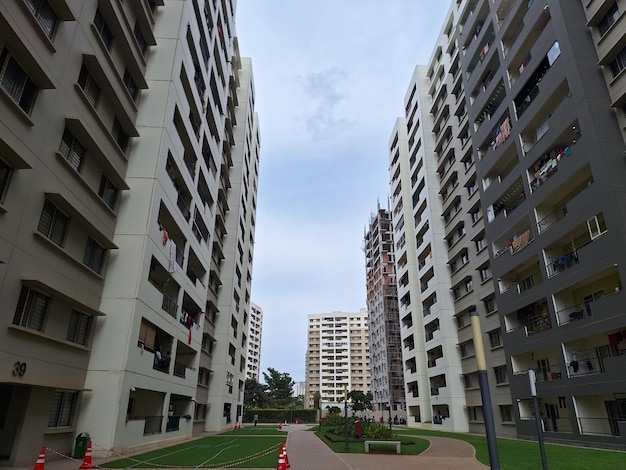 A street with tall buildings and a sign that says " apartment ".