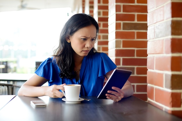 Stressed woman holding cup