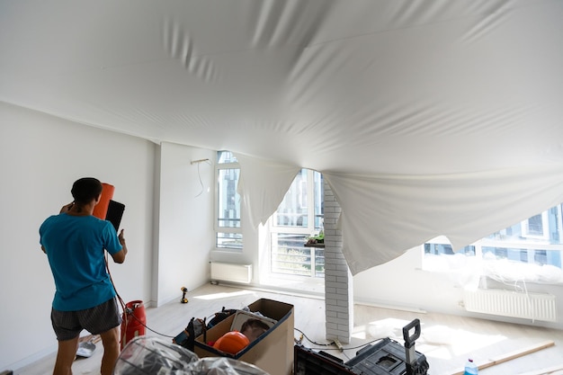 Stretch ceiling in the kitchen with installed and included spotlights