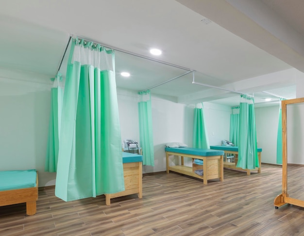 Stretchers with curtains in a rehabilitation clinic without people