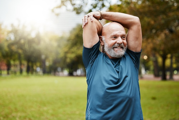 Stretching fitness and running with old man in park for health workout or sports with mockup Warm up retirement and exercise with senior runner in nature for training jogger and cardio endurance