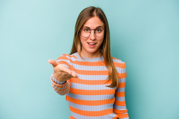 Stretching hand at camera in greeting gesture