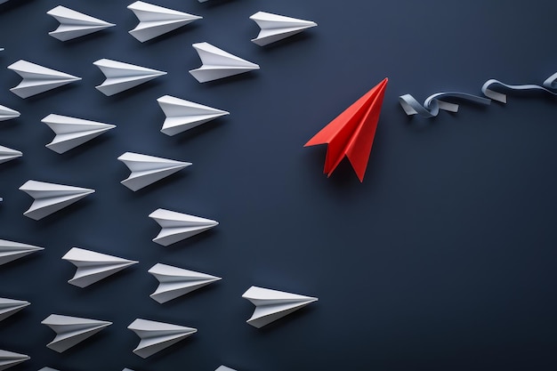 A striking red paper plane leading a formation of white ones against a blue backdrop symbolizing le