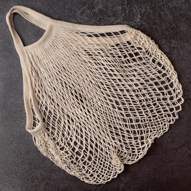 String bag on a dark background Flat lay top view Eco concept