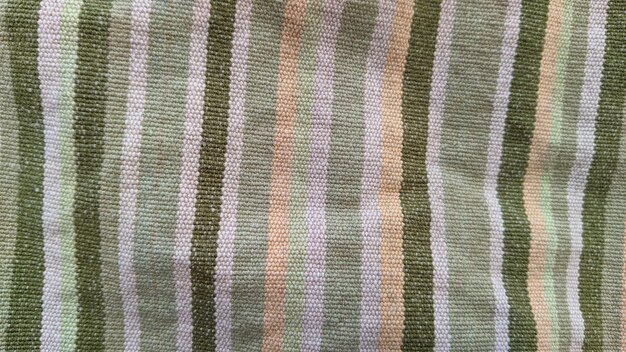 A striped fabric with a green stripe.