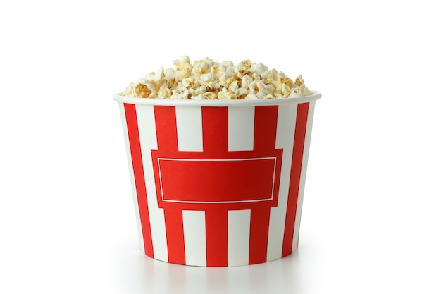 Striped paper cup with popcorn isolated on white background.