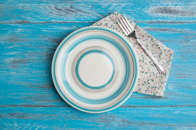 Striped plate on wood background