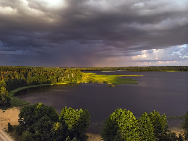 Stromy clouds over eautful peninsula between lakes snudy and strusto national park braslau lakes bel