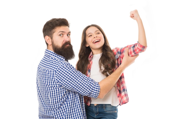 Strong as my father. Fathers day concept. Lovely father and cute kid strong family. Father and daughter hug white background. Child and dad best friends show biceps gesture. Parenthood and childhood.