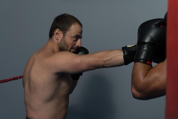 Strong Boxer And His Opponent During A Box Fight In A Ring