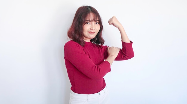 Strong gesture of Asian beautiful girl with red shirt in white background