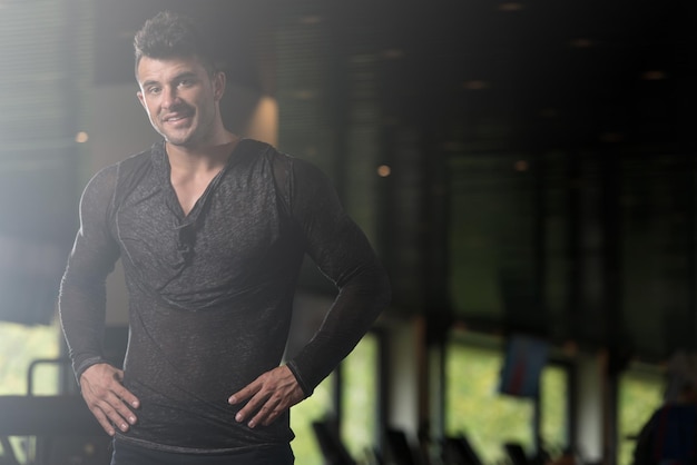 Strong Man in Black Tshirt Background Gym