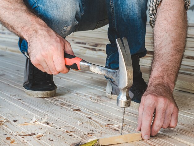 Strong men's hands and tools