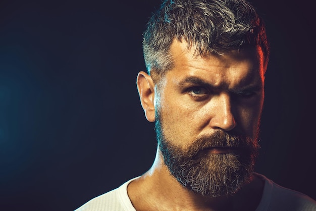 Strong muscular powerful fighter looks focused and confident. Brutal bearded boxer, ready to fight. Boxing, workout, muscle, strength, power - sport concept. Karate man. Male karate instructor closeup