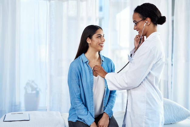 Strong set of lungs you have there Shot of a young doctor examining her patient with a stethoscope