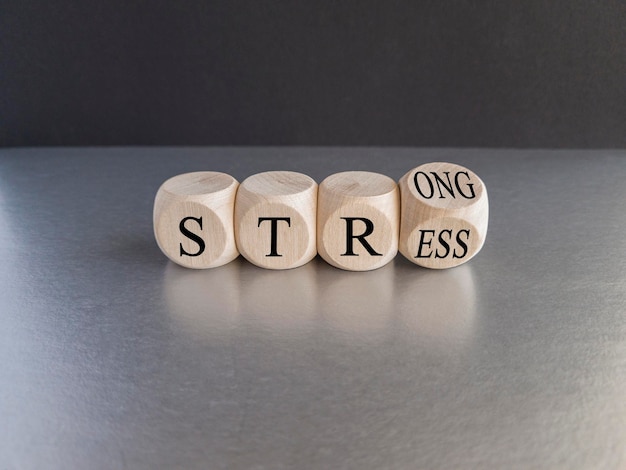 Strong stress symbolTurned wooden cubes with words 'strong stress'