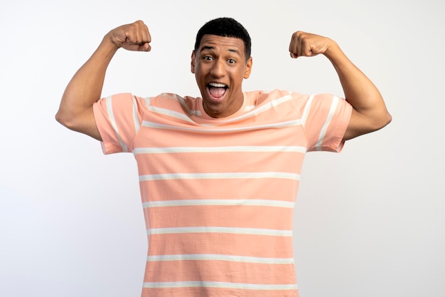 Strong young man posing isolated on white background studio portrait