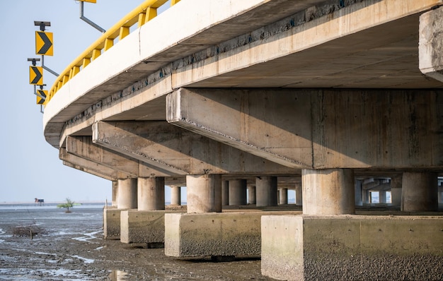 Structure of reinforced concrete bridge along the sea Bottom view of concrete bridge Concrete bridge