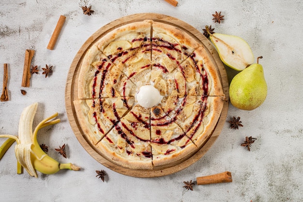 Strudel pizza with apples and ice cream Flat lay