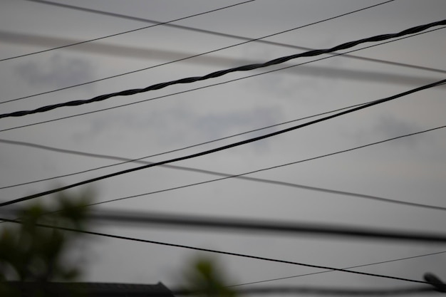 strung wires in the gray sky gloomy city sky