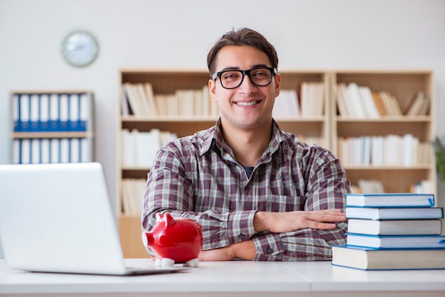 Student breaking piggybank to pay for tuition fees