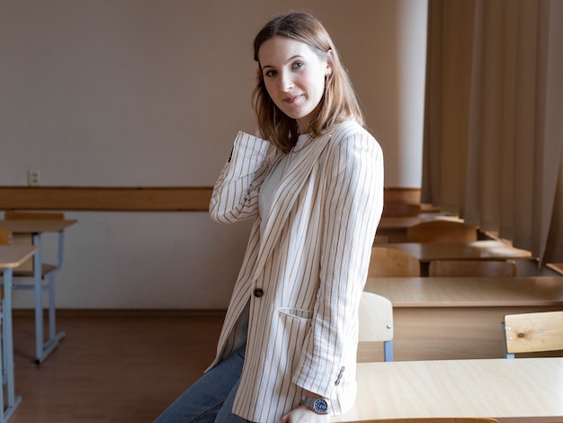 Student in class stand near the table