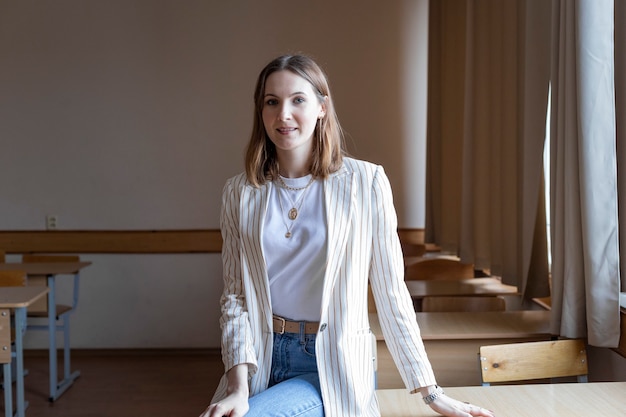 Student in class stand near the table