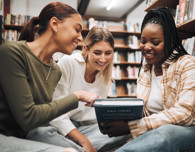 Student friends and book in school library for education learning or knowledge together at university Students smile for book club books or information for research assignment or group project