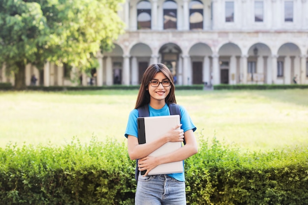 Student girl in front of a university