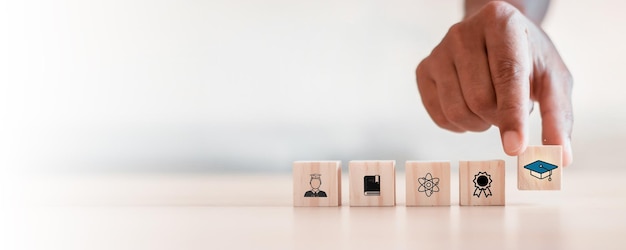 student icons on wooden blocks Education concept for success