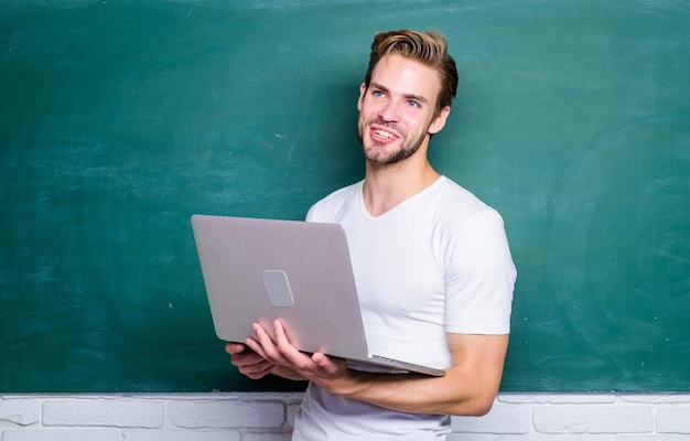 Student learn digital world School teacher with laptop Handsome man use modern technology Digital technology Surfing internet Online communications Programming web development Digital concept