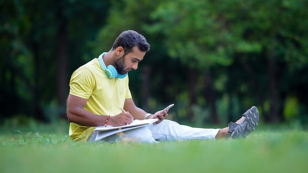 A student making a drawing by looking at the mobile