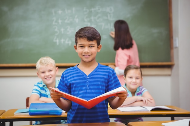 Student reading from a book