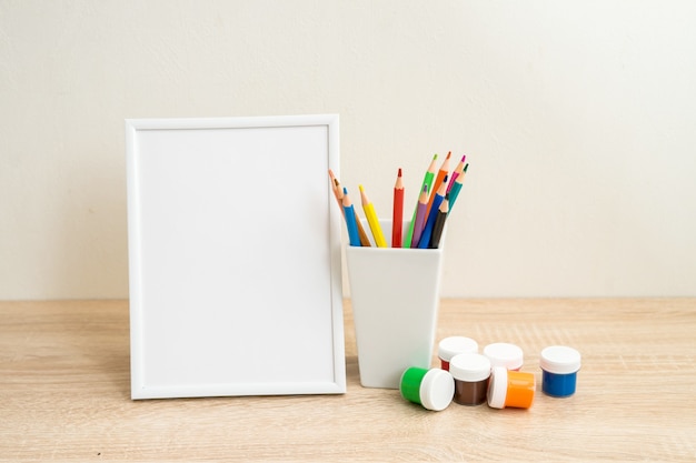 Student school frame mock up with colorful office supplies back to school