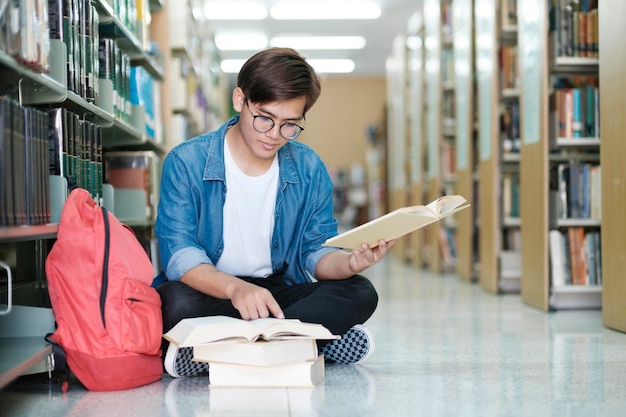 Student sitting and studying at library