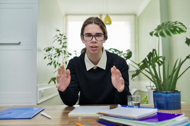 Student teenager talking looking at camera using video communication