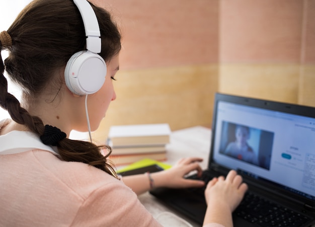 Student using a laptop at home