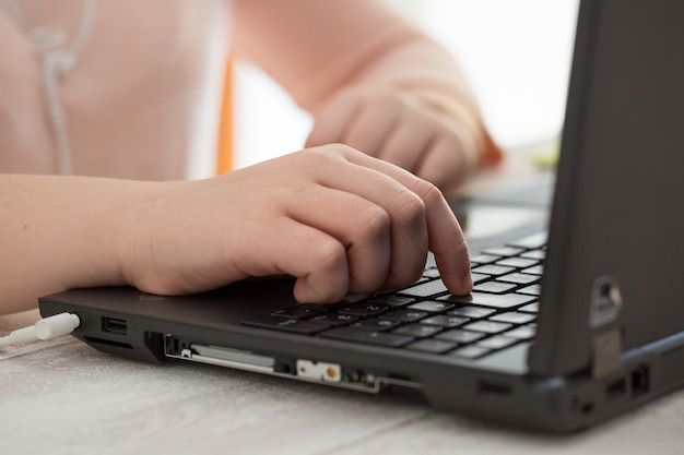 Student using a laptop at home