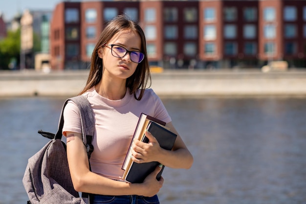 Student vaccination teenager girl after receiving the vaccine with a medical plaster on handstudent back to school or college or university after covid19 pandemic over