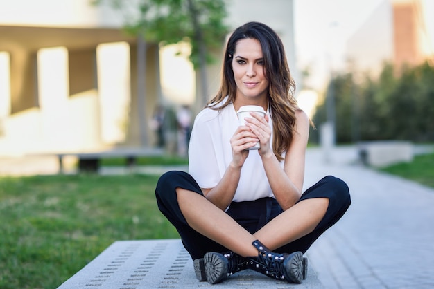 Student woman taking a coffee break at university