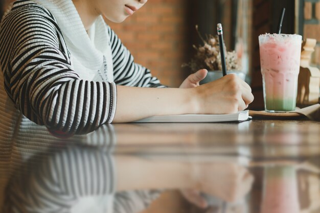 student  writing  something on the paper