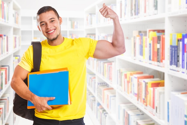 Student young man success successful strong power library education people