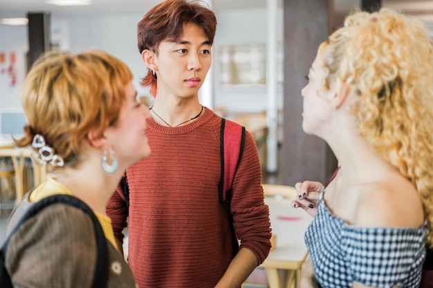 Students standing together in the university library