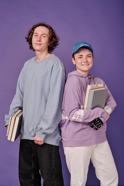 Students with books studying at school