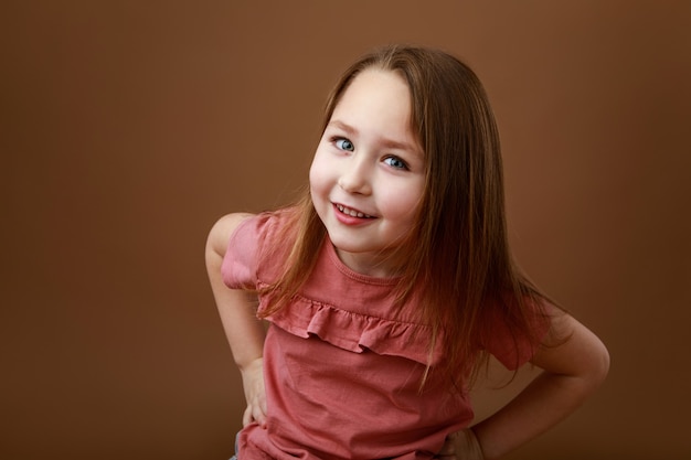 Studio portrait of funny smiling preschool girl