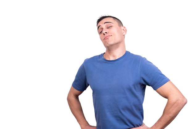 Studio portrait of a man with his hands on his hips and a proud expression in a white background